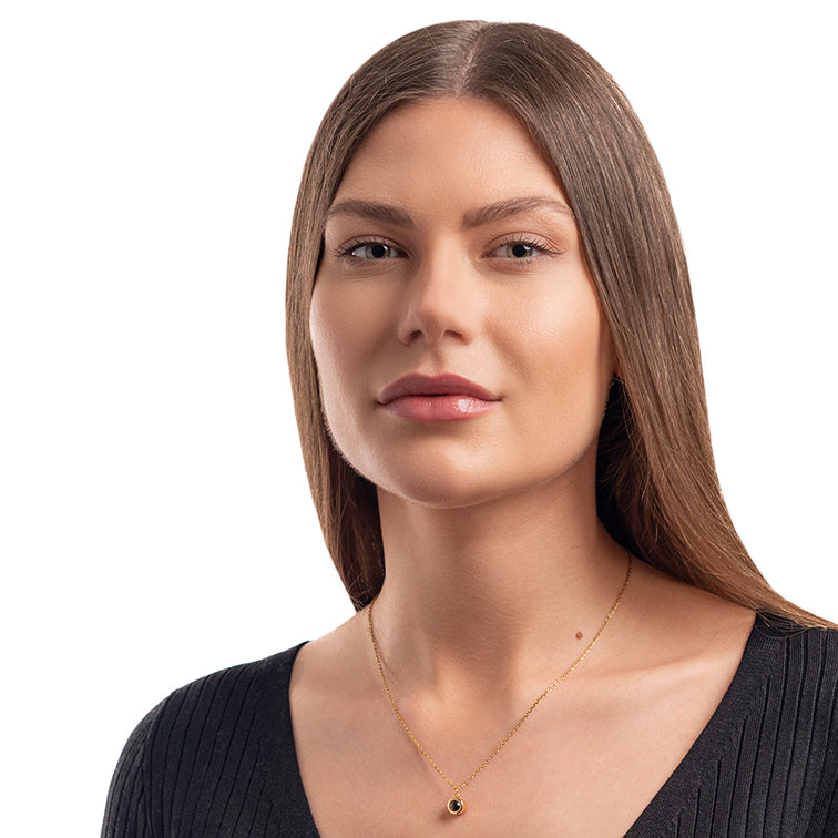 Full face model photo with round necklace with picture inside